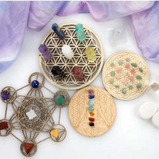 Coloured crystals arranged on wooden geometric grids for Crystal Reiki”.